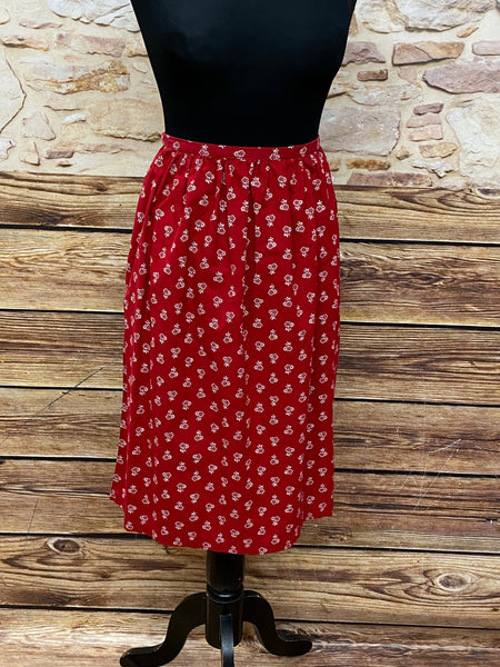 Rote Vintage Dirndl-Schürze für Damen mit weißen Blümchen, 59 cm lang, Baumwoll-Mischgewebe, Schleifenverschluss, sehr guter Zustand, secondhand.
