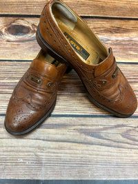 Vintage Lloyd of Europe Herrenschuhe Größe 40 in cognacbraunem Leder mit Brogue-Loafer-Design und „LL“-Metalldetail. Sehr guter Zustand.