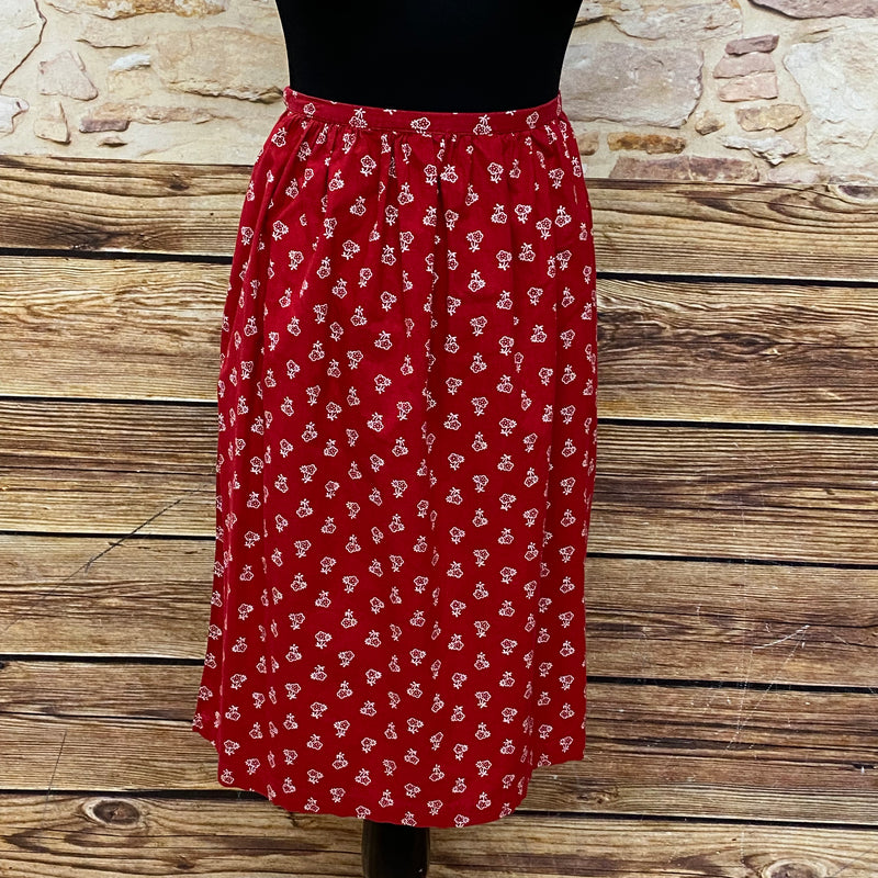 Rote Vintage Dirndl-Schürze für Damen mit weißen Blümchen, 59 cm lang, Baumwoll-Mischgewebe, Schleifenverschluss, sehr guter Zustand, secondhand.