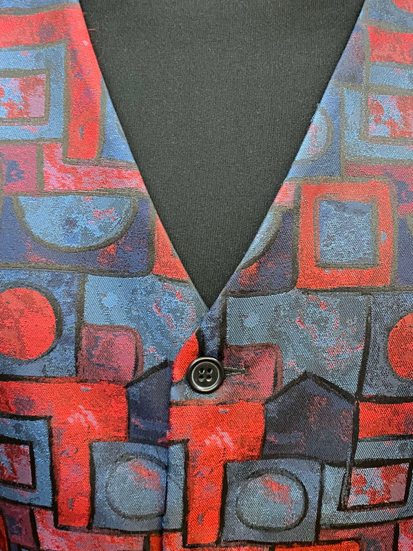 „Detail Herrenweste geometrisches Muster blau rot“