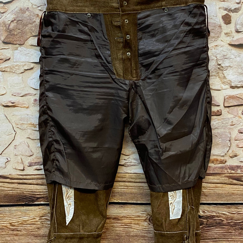 „Innenseite einer hochwertigen Vintage Trachtenlederhose mit braunem Futter und Lederbesatz“