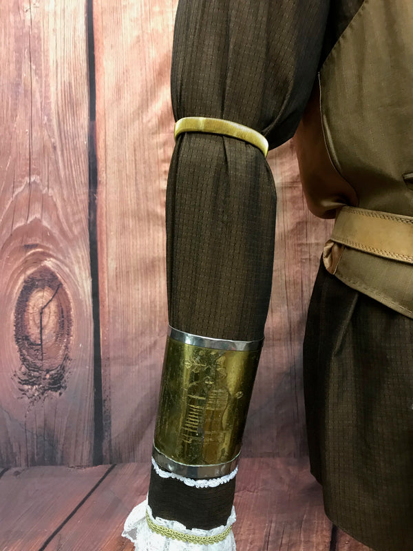 Armmanschette und Ärmelhalter in gold