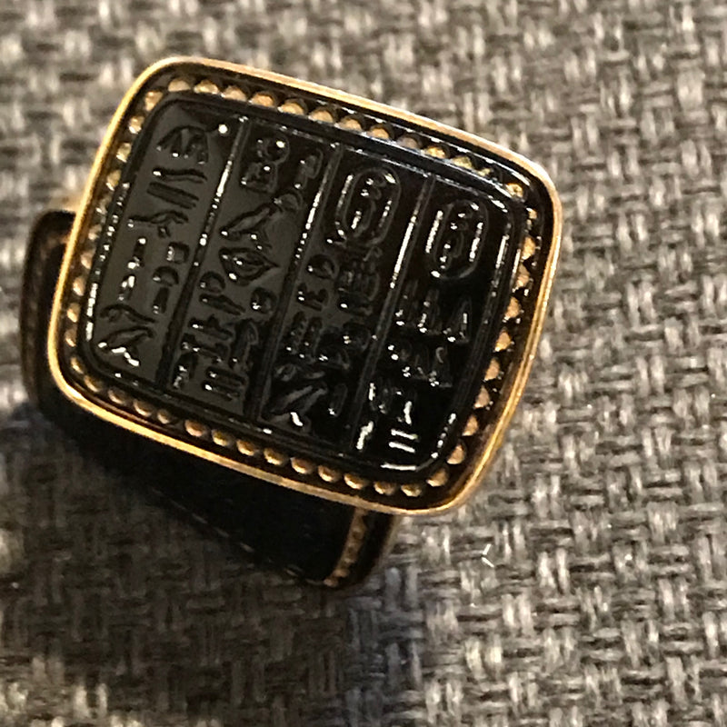 „Elegante goldfarbene Manschettenknöpfe mit schwarzem Glasstein“
